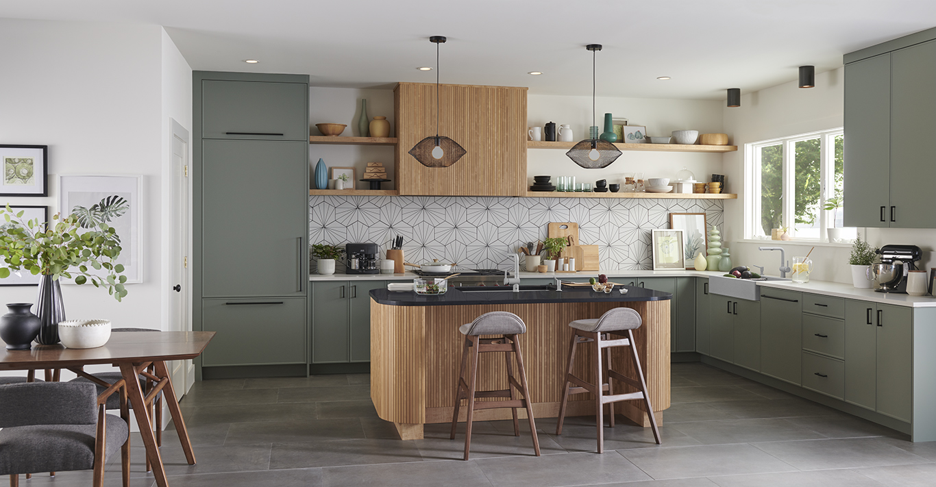 Landscape image of stylish modern kitchen transformation with sage green cabinet door fronts and drawers.