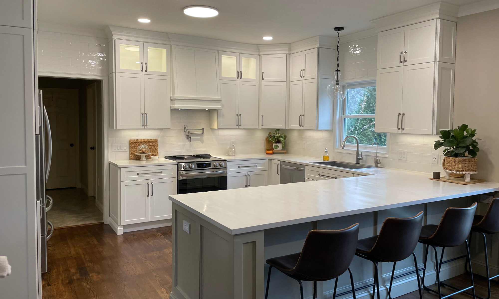 Modern kitchen with refaced cabinet doors and fronts - shaker profile in white color.