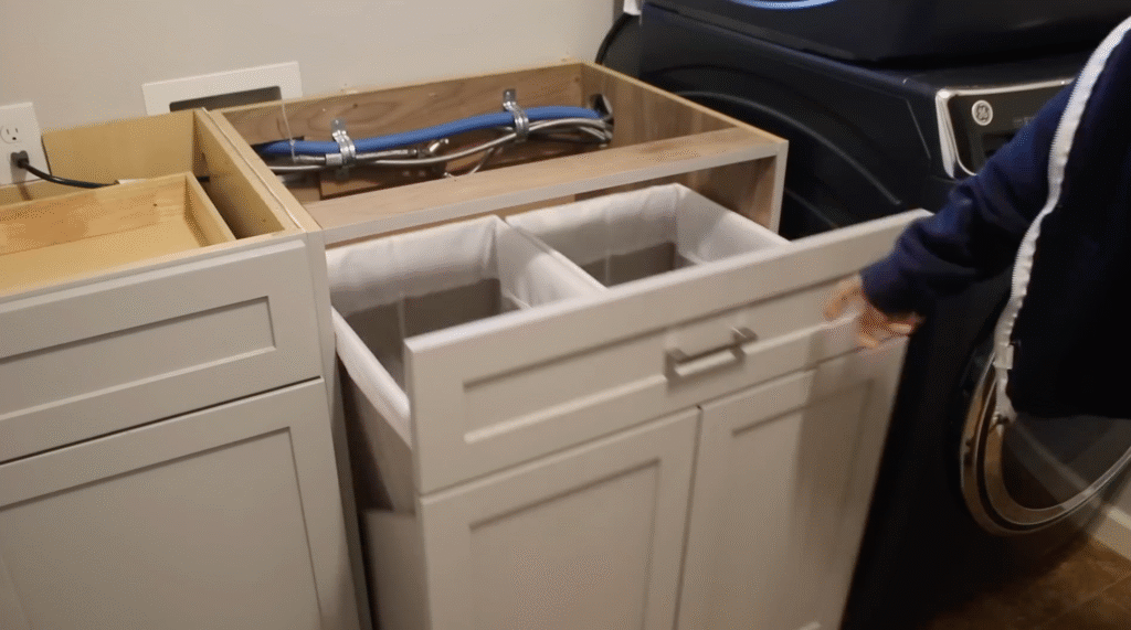 Hidden pull-out laundry hamper